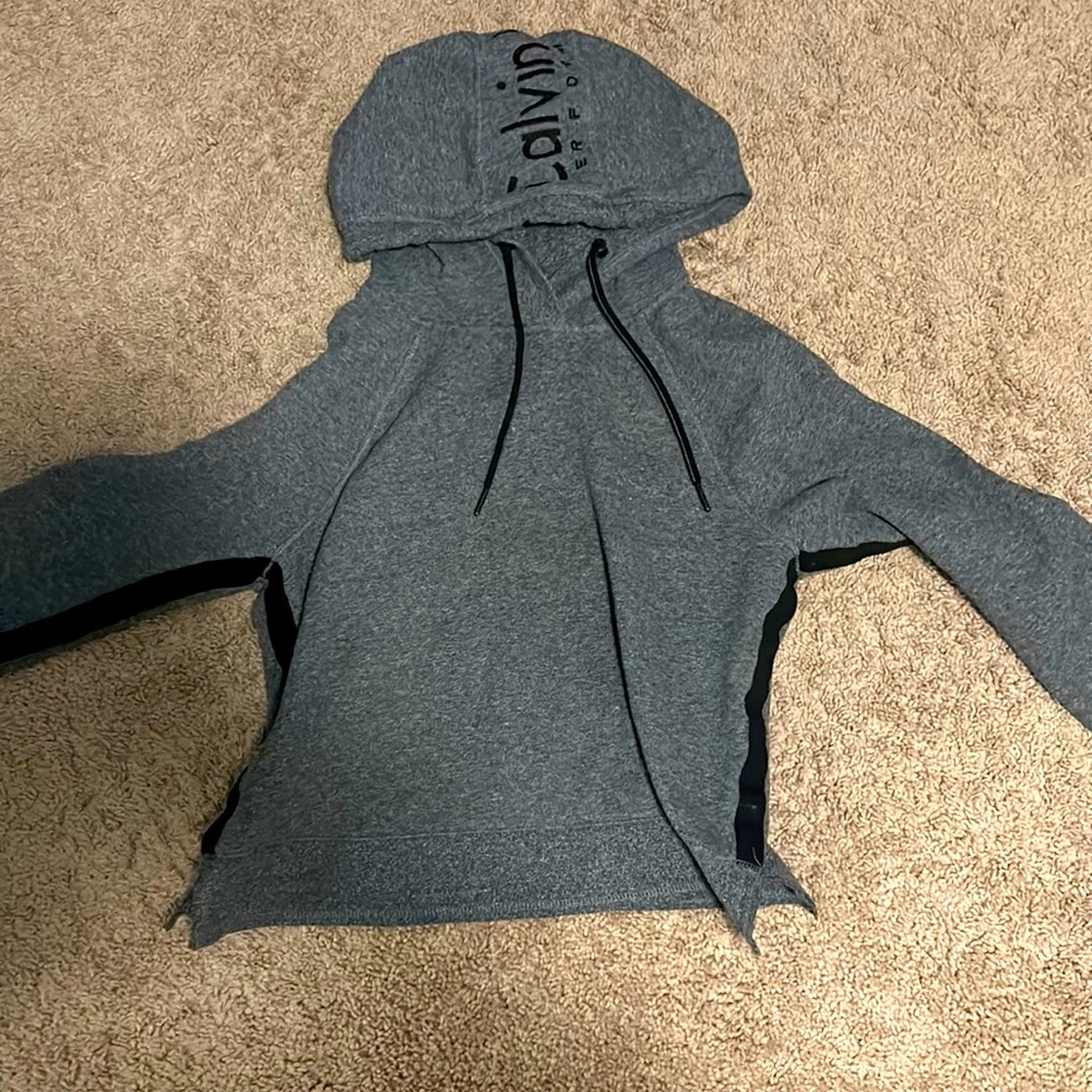 Like new, gray Calvin Klein xsmall sweatshirt, no makes or tears.